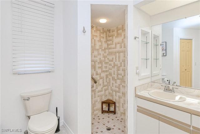 25379 Paladin Ln, Punta Gorda, FL 33983 - bathroom featuring tiled shower, vanity, and toilet