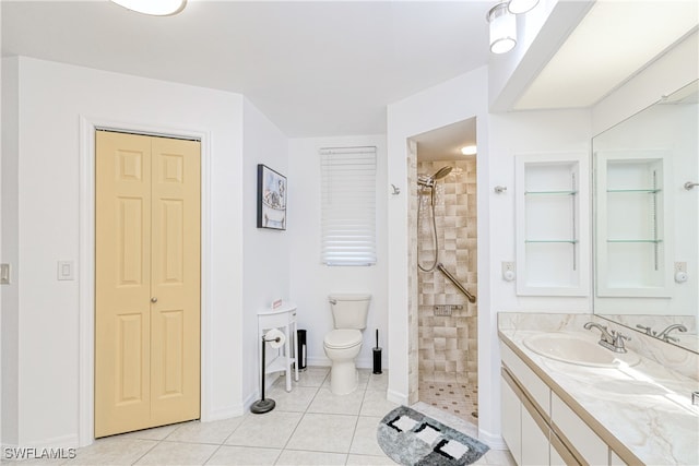 25379 Paladin Ln, Punta Gorda, FL 33983 - bathroom with vanity, toilet, tiled shower, and tile patterned floors
