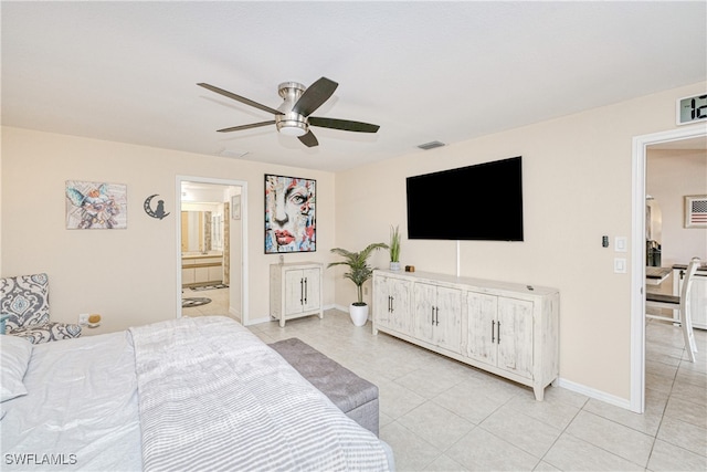 25379 Paladin Ln, Punta Gorda, FL 33983 - bedroom with light tile patterned flooring, baseboards, a ceiling fan, and ensuite bath