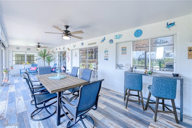 25379 Paladin Ln, Punta Gorda, FL 33983 - wooden terrace featuring a ceiling fan and outdoor dining space