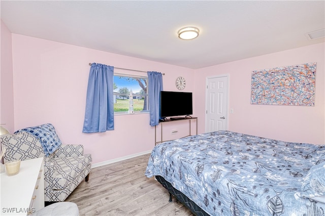25379 Paladin Ln, Punta Gorda, FL 33983 - bedroom featuring light wood-style floors and baseboards