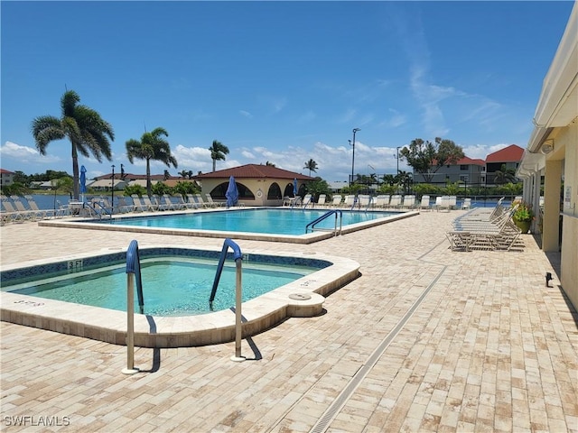 11460 Caravel Cir Unit 5016, Fort Myers, FL 33908 - community pool featuring a patio and a hot tub