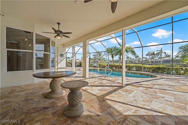 1069 SW 57th St, Cape Coral, FL 33914 - swimming pool with ceiling fan, a patio, and a lanai