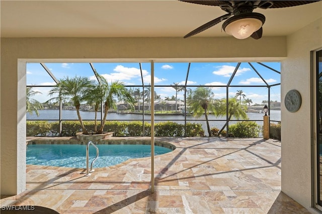 1069 SW 57th St, Cape Coral, FL 33914 - swimming pool with a water view, a lanai, a patio, and a ceiling fan