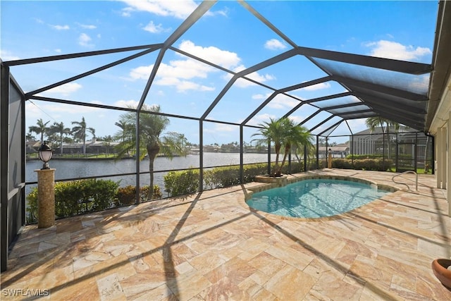 1069 SW 57th St, Cape Coral, FL 33914 - swimming pool with a water view, a patio area, and a lanai