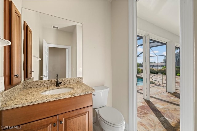 1069 SW 57th St, Cape Coral, FL 33914 - half bath with vanity, marble tiled flooring, and inlaid floor details