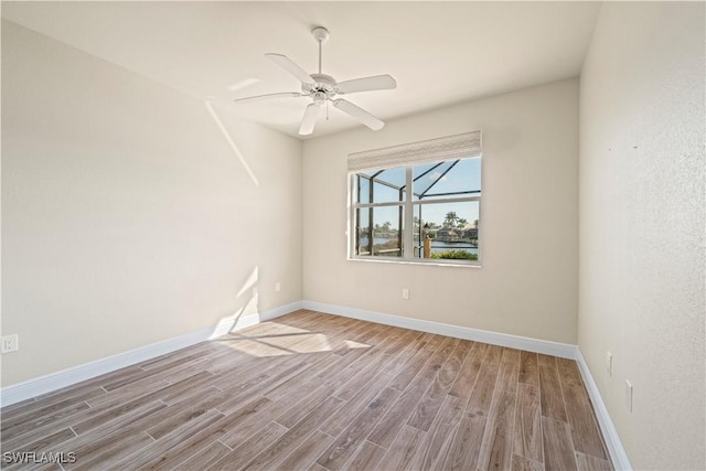1069 SW 57th St, Cape Coral, FL 33914 - unfurnished room featuring wood finished floors and a ceiling fan