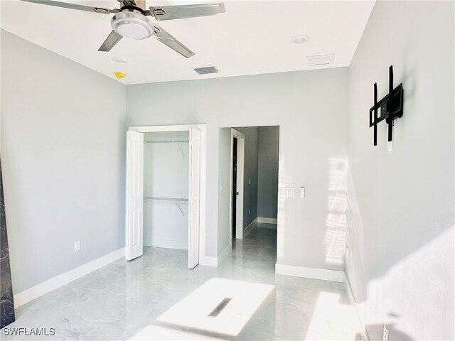 3016 6th St W, Lehigh Acres, FL 33971 - unfurnished bedroom featuring a closet, ceiling fan, and baseboards