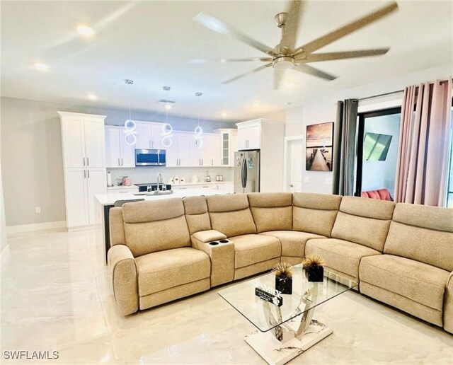 3016 6th St W, Lehigh Acres, FL 33971 - living area featuring ceiling fan, light marble finish flooring, recessed lighting, and baseboards