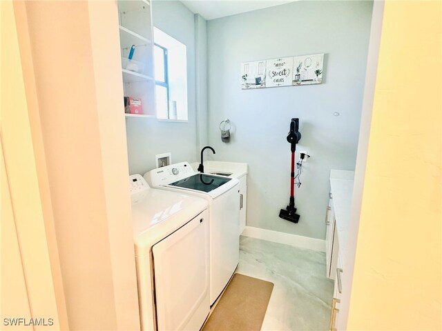 3016 6th St W, Lehigh Acres, FL 33971 - laundry area with cabinet space and washing machine and clothes dryer