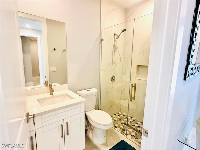 3016 6th St W, Lehigh Acres, FL 33971 - bathroom featuring a marble finish shower, toilet, and vanity