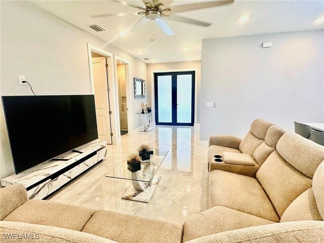 3016 6th St W, Lehigh Acres, FL 33971 - living area featuring light marble finish floors, ceiling fan, french doors, recessed lighting, and baseboards