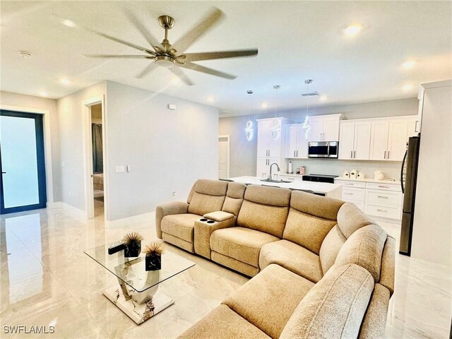 3016 6th St W, Lehigh Acres, FL 33971 - living area featuring ceiling fan, recessed lighting, and light marble finish flooring