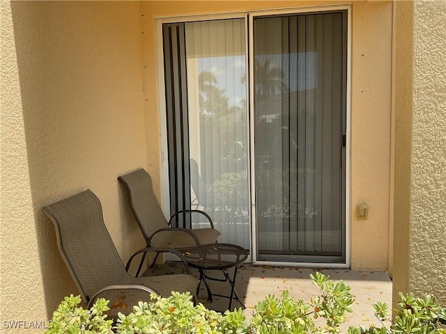 1516 SW 50th St Unit 104, Cape Coral, FL 33914 - doorway to property with stucco siding