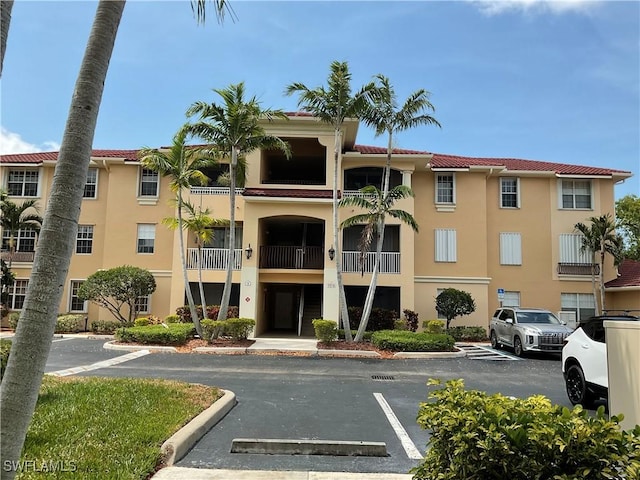 1516 SW 50th St Unit 104, Cape Coral, FL 33914 - view of property featuring uncovered parking
