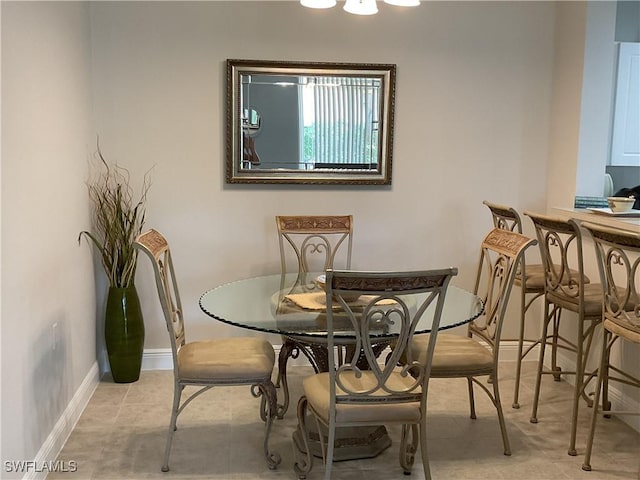 1516 SW 50th St Unit 104, Cape Coral, FL 33914 - dining room with baseboards and tile patterned floors