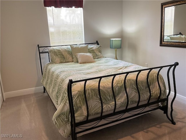 1516 SW 50th St Unit 104, Cape Coral, FL 33914 - bedroom with baseboards and carpet floors