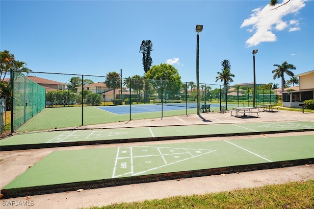 3350 Alouette Cir Unit 1, Fort Myers, FL 33907 - view of community featuring a tennis court and shuffleboard