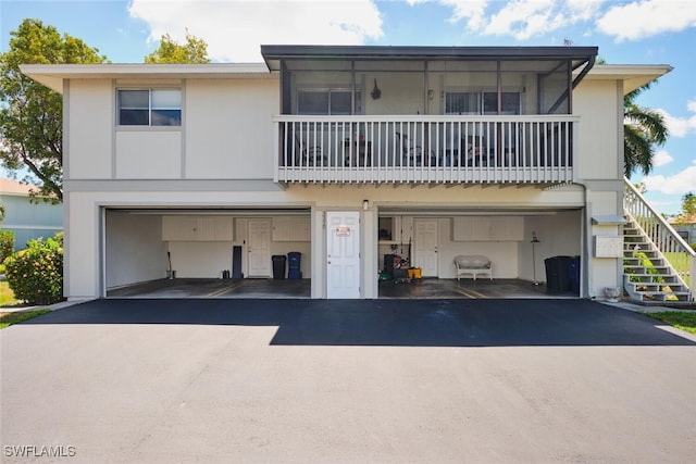 3350 Alouette Cir Unit 1, Fort Myers, FL 33907 - view of front of property with stairs, driveway, and an attached garage