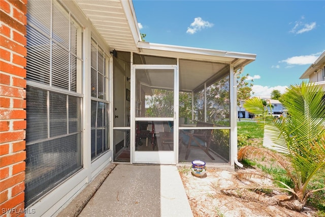 3350 Alouette Cir Unit 1, Fort Myers, FL 33907 - view of patio featuring a sunroom