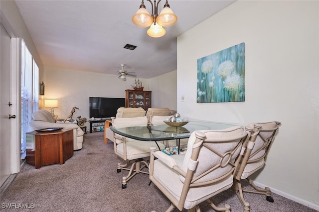 3350 Alouette Cir Unit 1, Fort Myers, FL 33907 - carpeted dining space featuring a ceiling fan, baseboards, and a chandelier