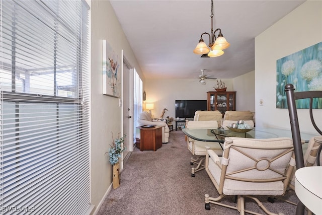3350 Alouette Cir Unit 1, Fort Myers, FL 33907 - carpeted dining area featuring a chandelier and a ceiling fan