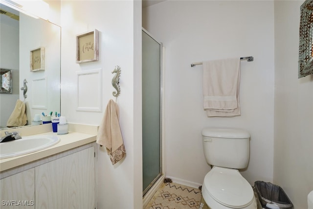 3350 Alouette Cir Unit 1, Fort Myers, FL 33907 - bathroom featuring toilet, vanity, a shower stall, and baseboards