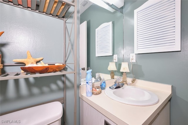 3350 Alouette Cir Unit 1, Fort Myers, FL 33907 - bathroom with vanity and toilet