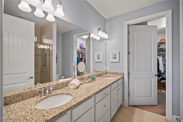 20245 Corkscrew Shores Blvd, Estero, FL 33928 - full bath featuring a walk in closet, double vanity, tile patterned flooring, and toilet