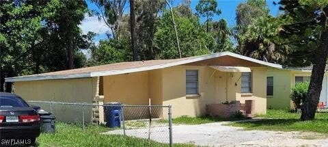 view of side of property with stucco siding