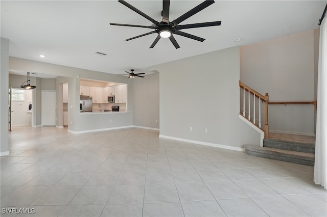2810 Blossom Way, Naples, FL 34120 - unfurnished living room featuring a ceiling fan, recessed lighting, stairs, baseboards, and light tile patterned flooring