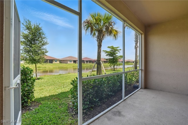 2810 Blossom Way, Naples, FL 34120 - unfurnished sunroom featuring a water view and a residential view