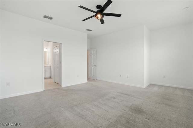 2810 Blossom Way, Naples, FL 34120 - unfurnished bedroom featuring light carpet, baseboards, and ensuite bath