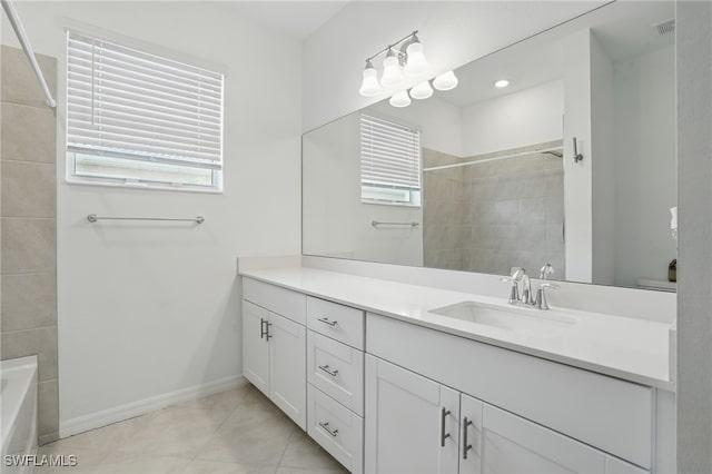 2810 Blossom Way, Naples, FL 34120 - full bath featuring vanity, healthy amount of natural light, tile patterned flooring, and baseboards