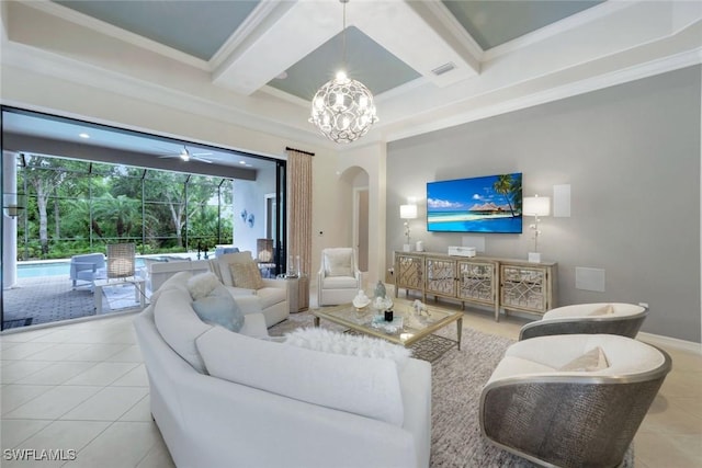 6419 Vivaldi Ct, Naples, FL 34113 - tiled living room featuring arched walkways, coffered ceiling, beamed ceiling, ornamental molding, and a chandelier