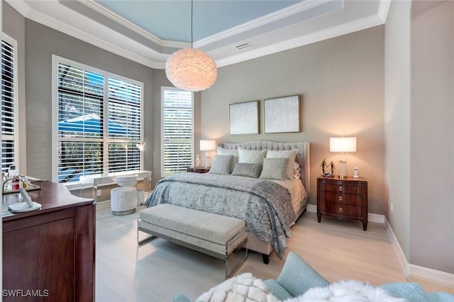 6419 Vivaldi Ct, Naples, FL 34113 - bedroom featuring a tray ceiling, crown molding, light wood-style floors, and baseboards