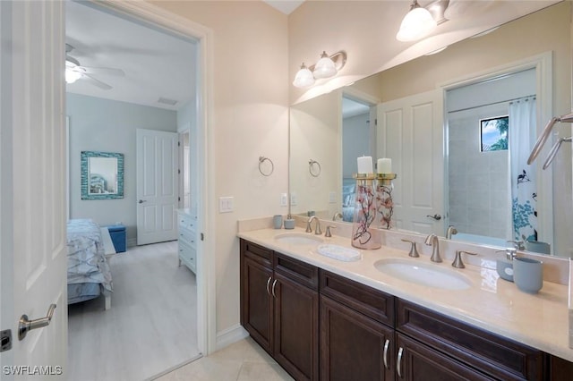 6419 Vivaldi Ct, Naples, FL 34113 - ensuite bathroom with double vanity, ceiling fan, and baseboards