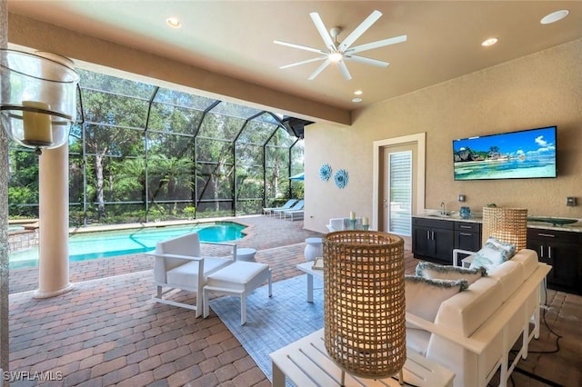 6419 Vivaldi Ct, Naples, FL 34113 - view of patio / terrace with an outdoor living space, a sink, an outdoor pool, a lanai, and a ceiling fan