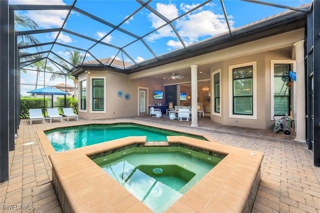 6419 Vivaldi Ct, Naples, FL 34113 - view of pool with a patio, a ceiling fan, a pool with connected hot tub, and glass enclosure