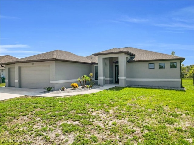 1633 SW 22nd Ct, Cape Coral, FL 33991 - prairie-style house featuring an attached garage, a front yard, concrete driveway, and stucco siding