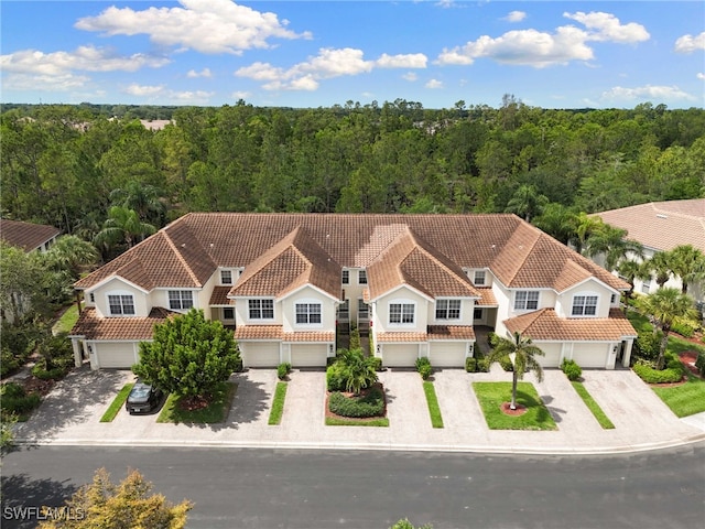 1335 Henley St Unit 802, Naples, FL 34105 - aerial view of property and surrounding area featuring a heavily wooded area