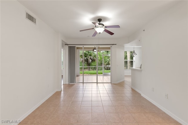 1335 Henley St Unit 802, Naples, FL 34105 - empty room featuring ceiling fan, light tile patterned floors, and baseboards