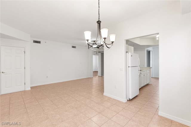 1335 Henley St Unit 802, Naples, FL 34105 - spare room with a chandelier and baseboards