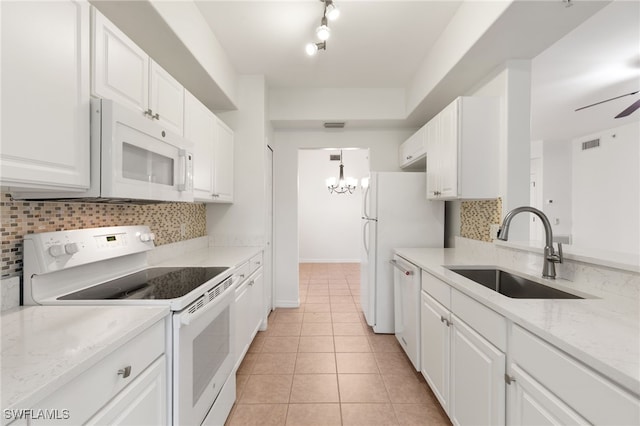 1335 Henley St Unit 802, Naples, FL 34105 - kitchen with white appliances, a sink, decorative backsplash, white cabinetry, and light tile patterned floors