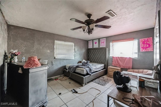 bedroom featuring light tile patterned floors and ceiling fan