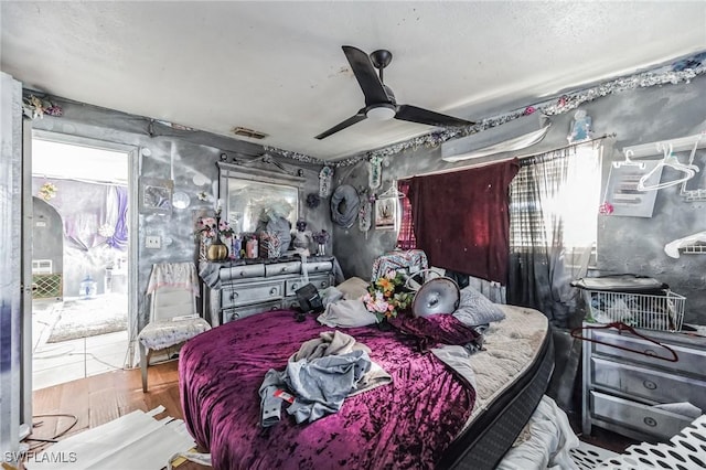 bedroom featuring wood finished floors and a ceiling fan