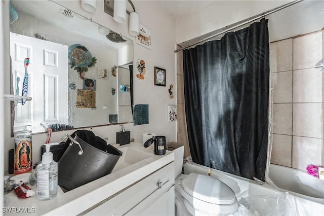 full bath featuring shower / bathtub combination with curtain, vanity, and toilet
