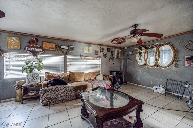 living area featuring light tile patterned floors, crown molding, ceiling fan, and a wood stove