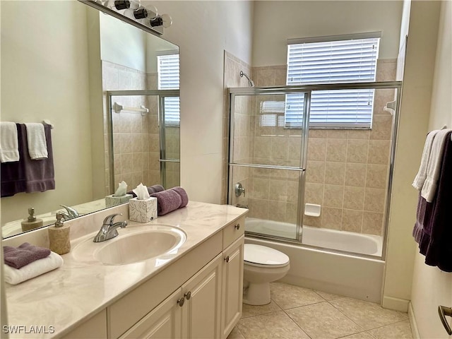 28171 L Burton Fletcher Ct, Bonita Springs, FL 34135 - bathroom featuring healthy amount of natural light, vanity, toilet, and tile patterned floors