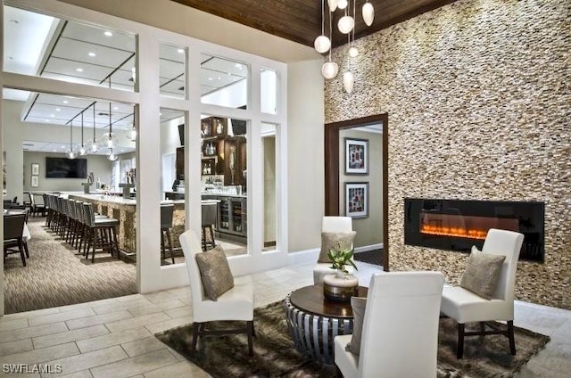 28171 L Burton Fletcher Ct, Bonita Springs, FL 34135 - building lobby with a towering ceiling, wooden ceiling, and recessed lighting